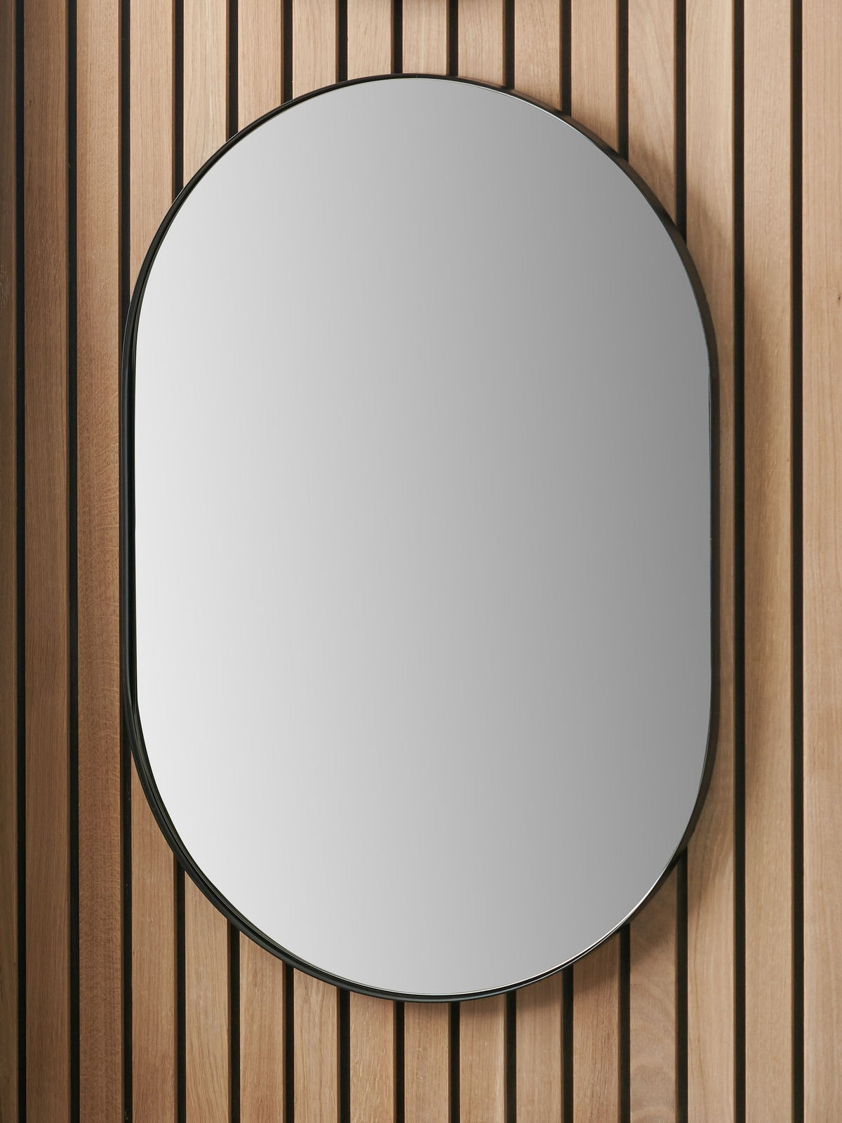 Pacific black metal slim frame oval wall mirror 90x60cm - British product