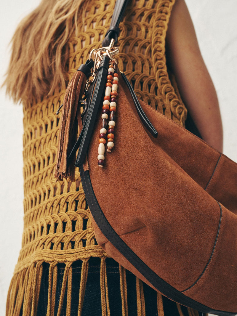 Tan brown suede charm sling bag with tassel, imported from the UK