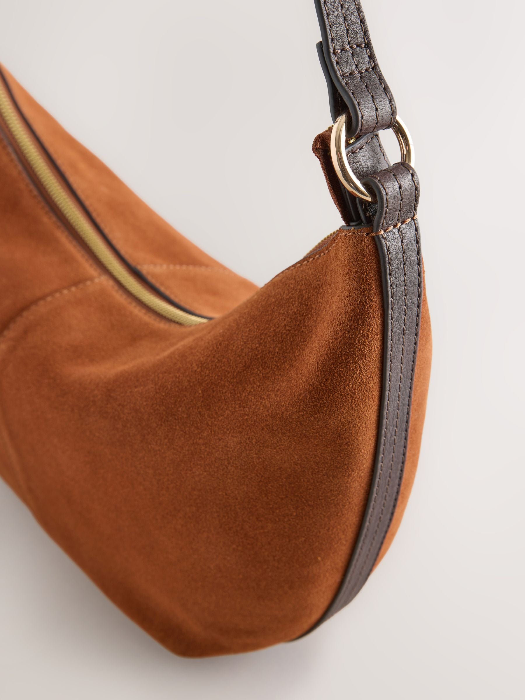 Tan brown suede charm sling bag with tassel, imported from the UK