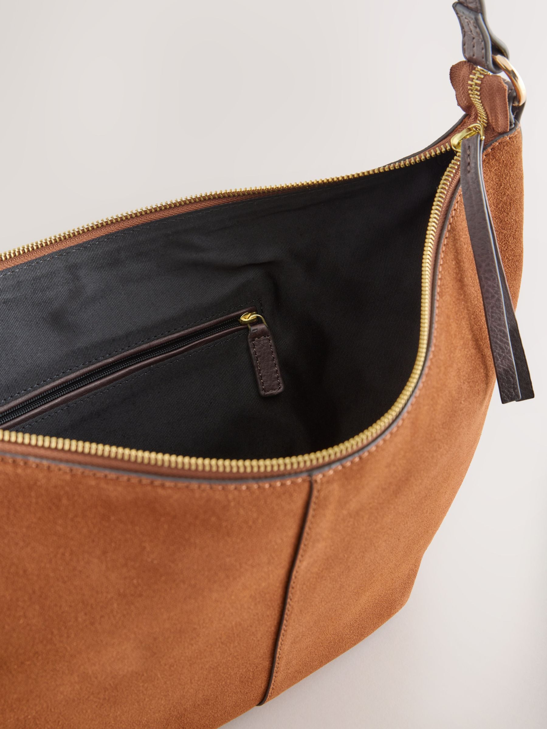 Tan brown suede charm sling bag with tassel, imported from the UK