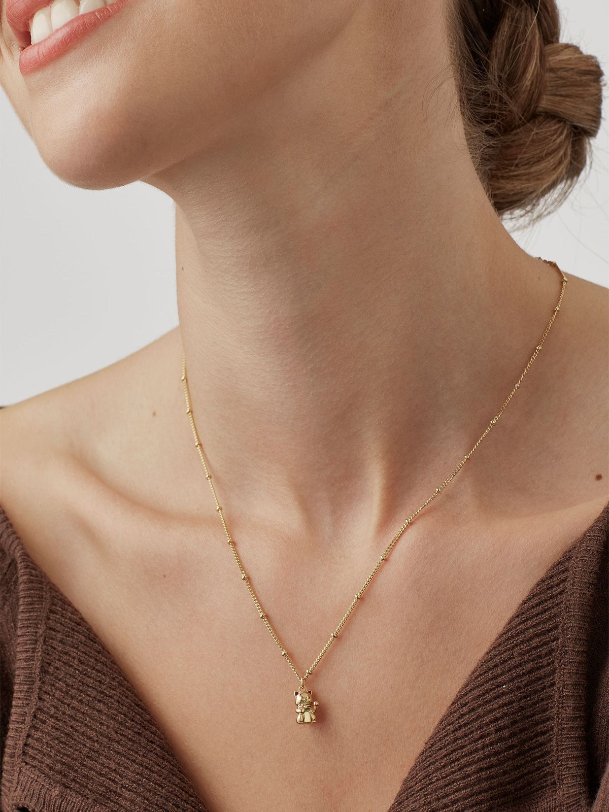 Estella Bartlett lucky cat gold tone necklace, imported from the UK