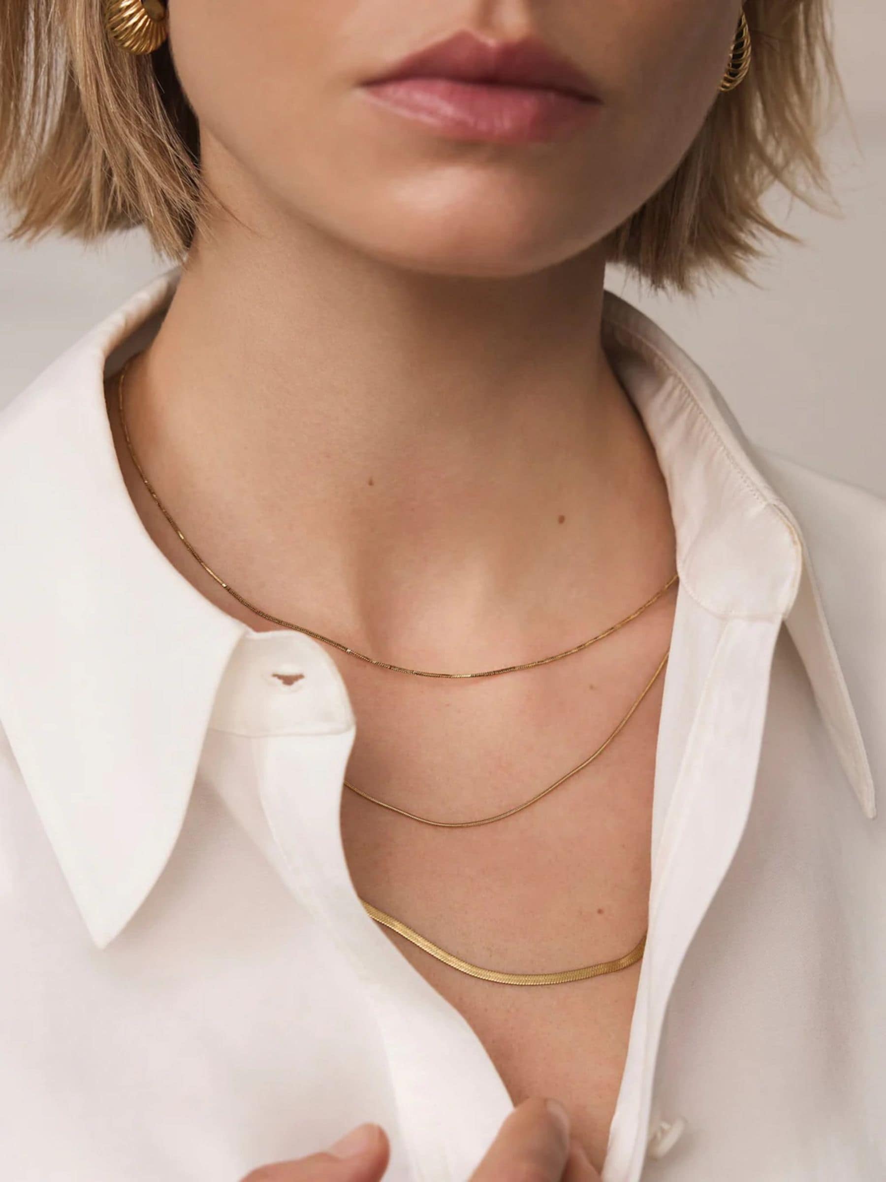 Mint Velvet gold tone triple layered necklace, UK version