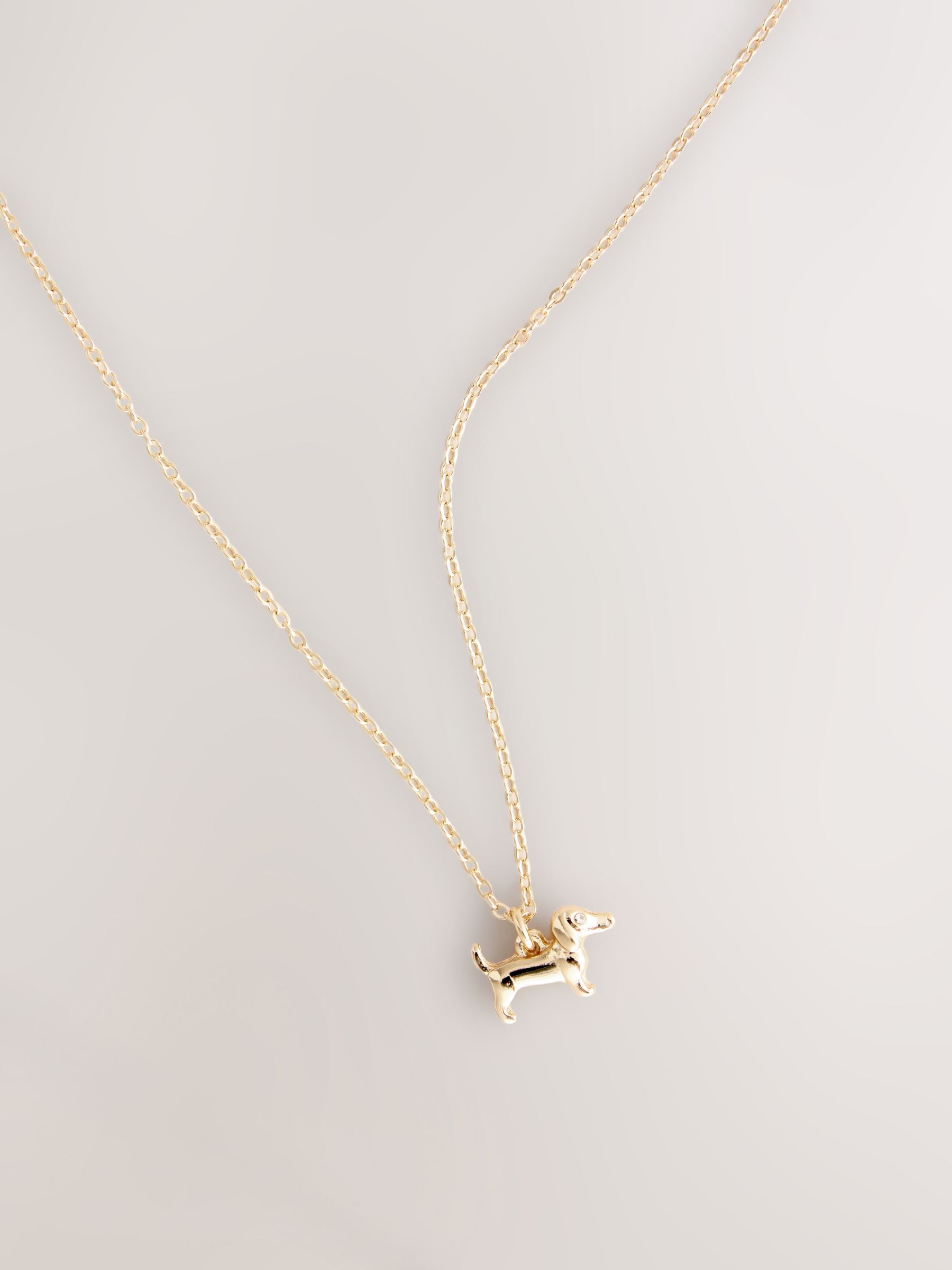 Gold tone sausage dog pendant necklace (British brand)