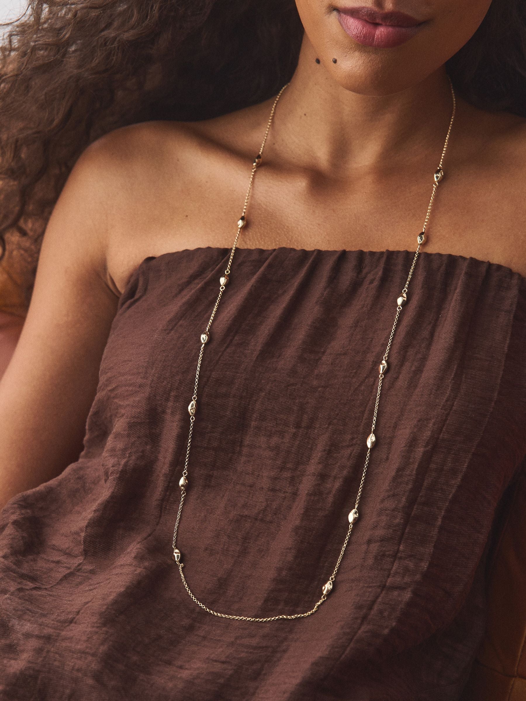 Gold tone rope beaded long necklace, imported from the UK
