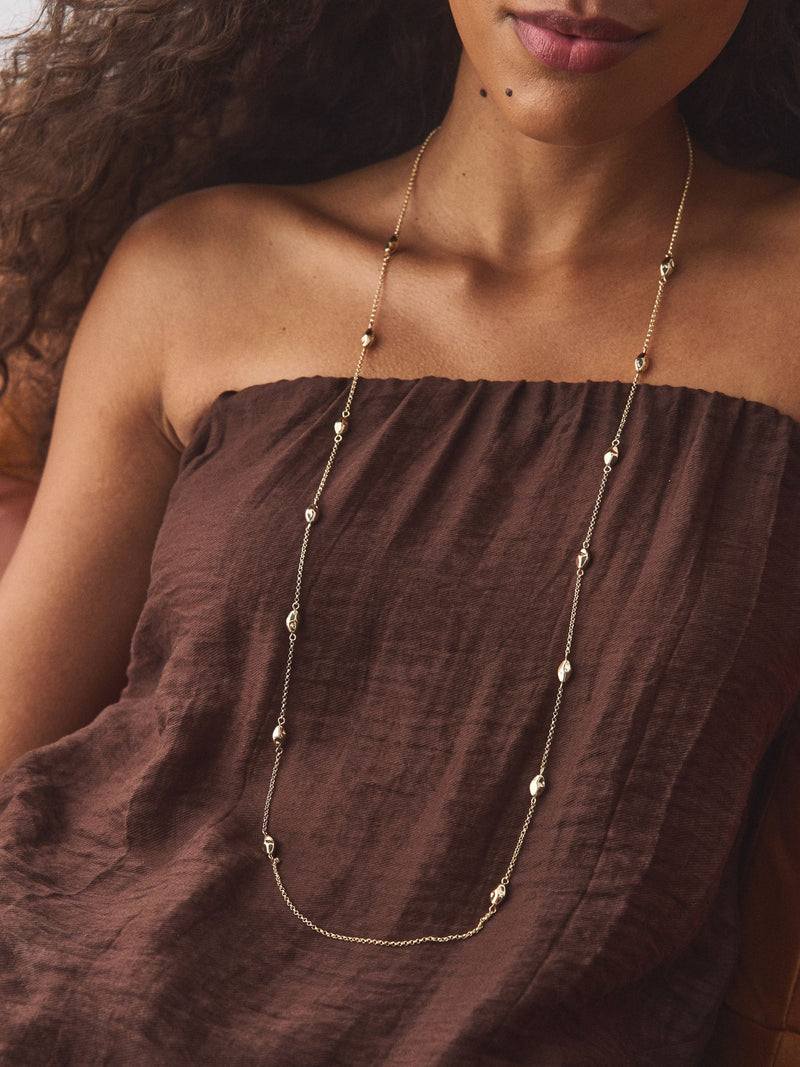 Gold tone rope beaded long necklace, imported from the UK