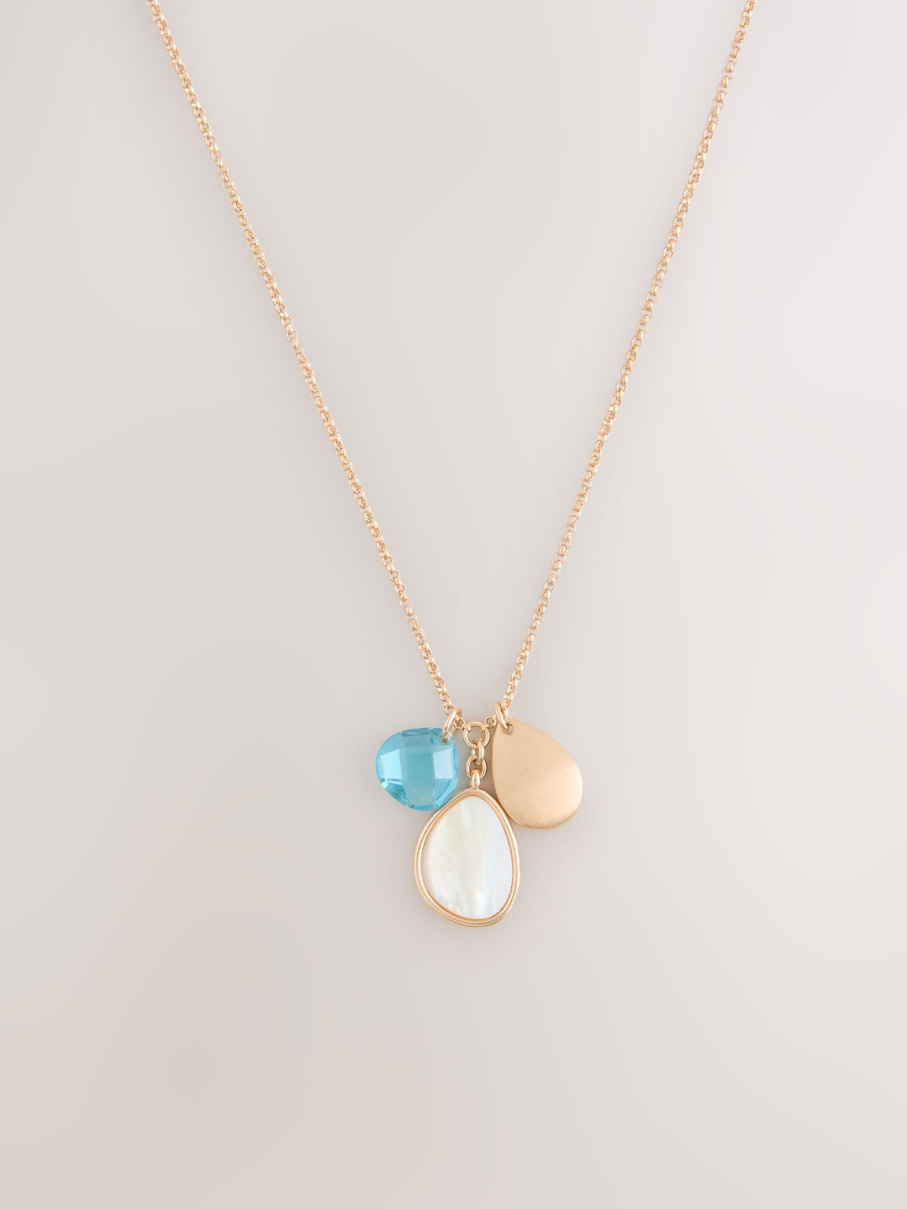 Gold tone cluster disc necklace with turquoise gemstone (British brand)