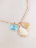 Gold tone cluster disc necklace with turquoise gemstone (British brand)