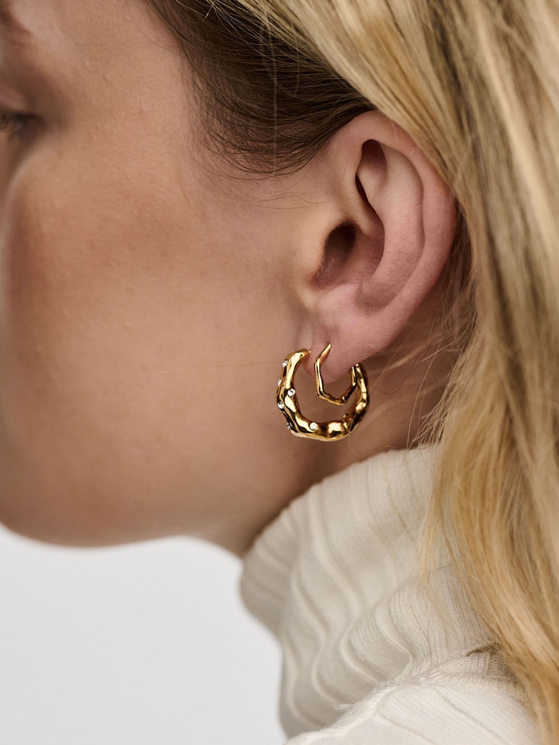 Orelia London gold tone wave huggie hoop earrings, imported from the UK
