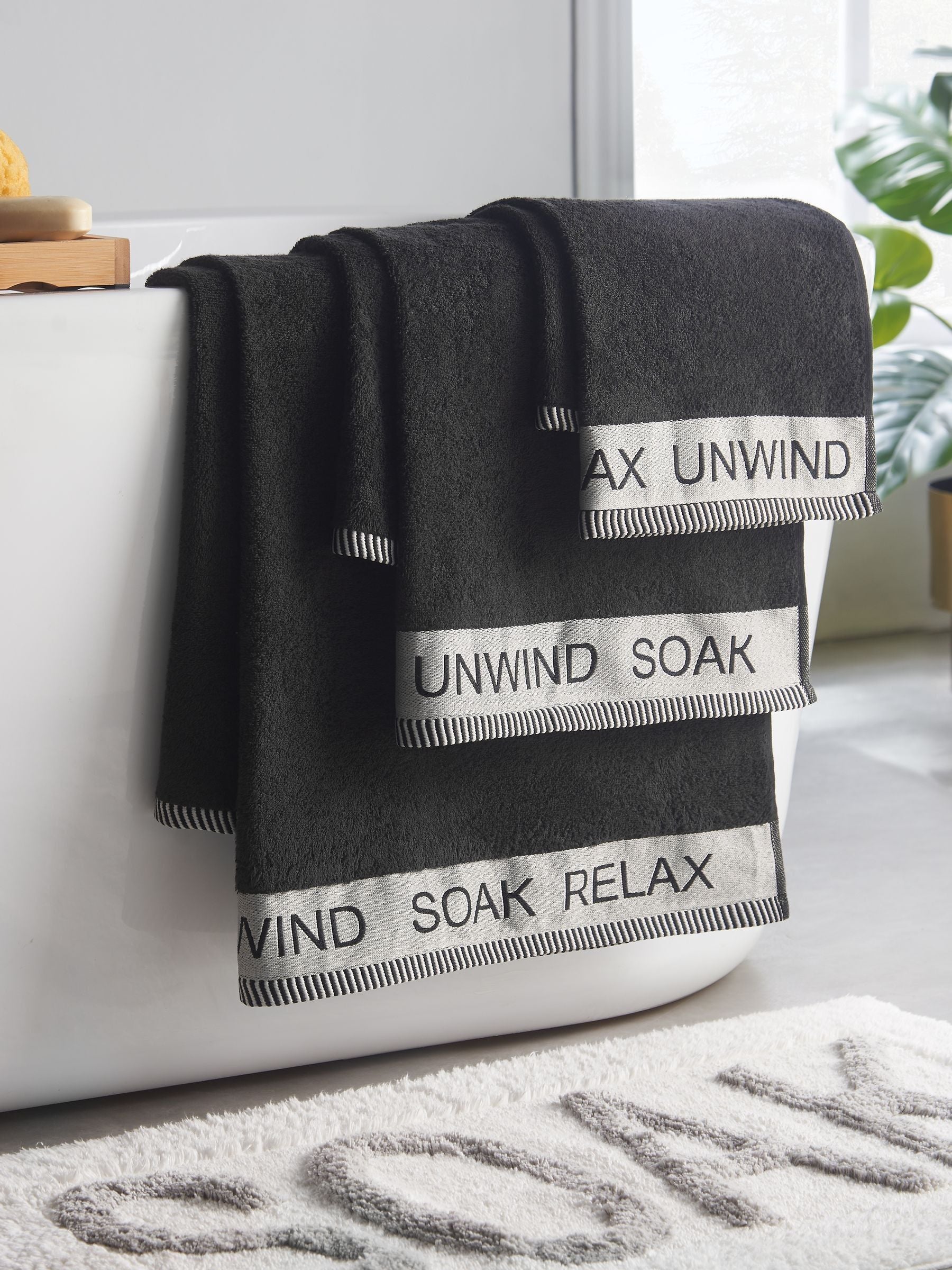 Catherine Lansfield Black Relax and Unwind towel collection (British brand)