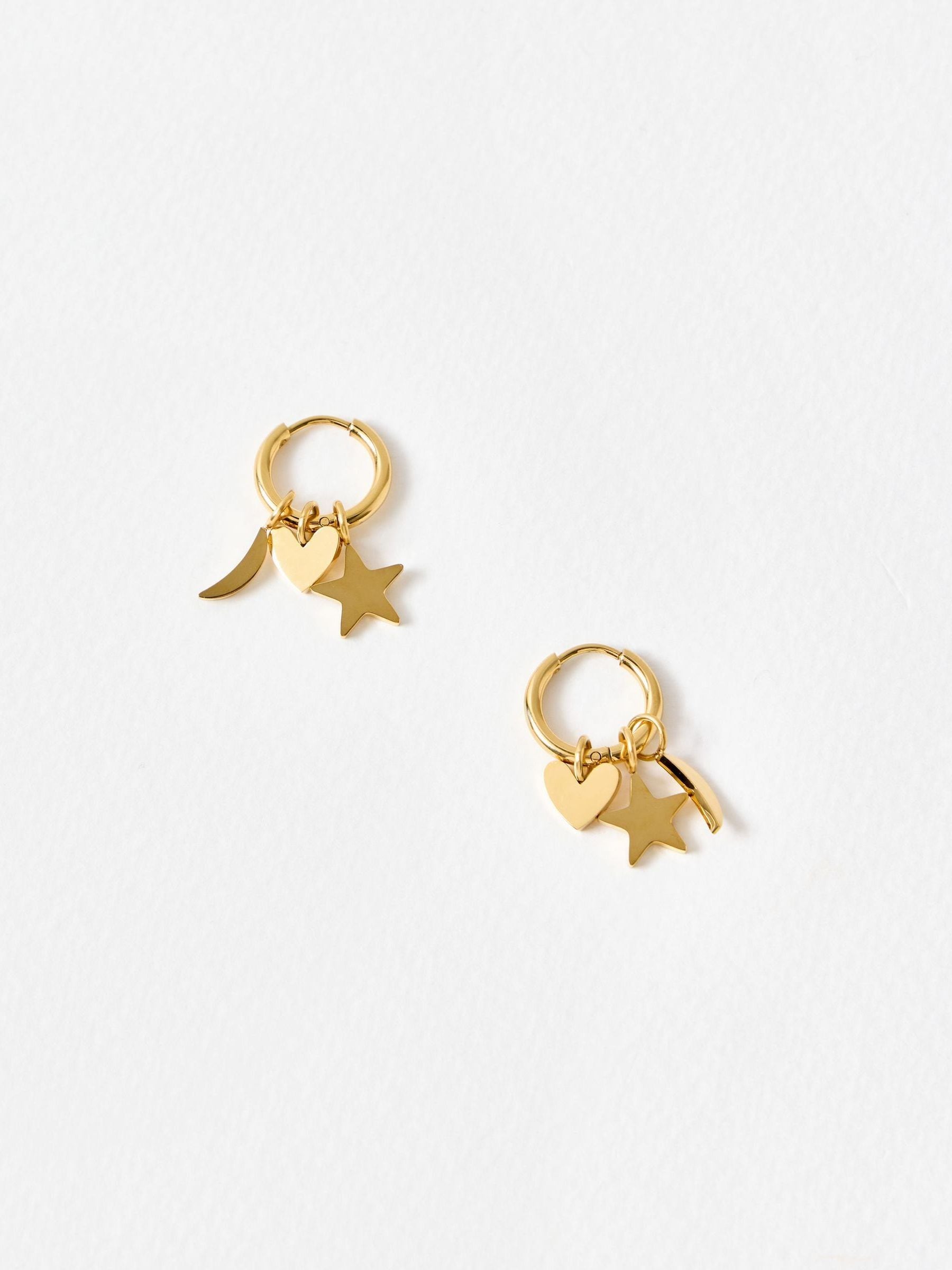Oliver Bonas gold tone hoop earrings with star moon heart charms (British brand)