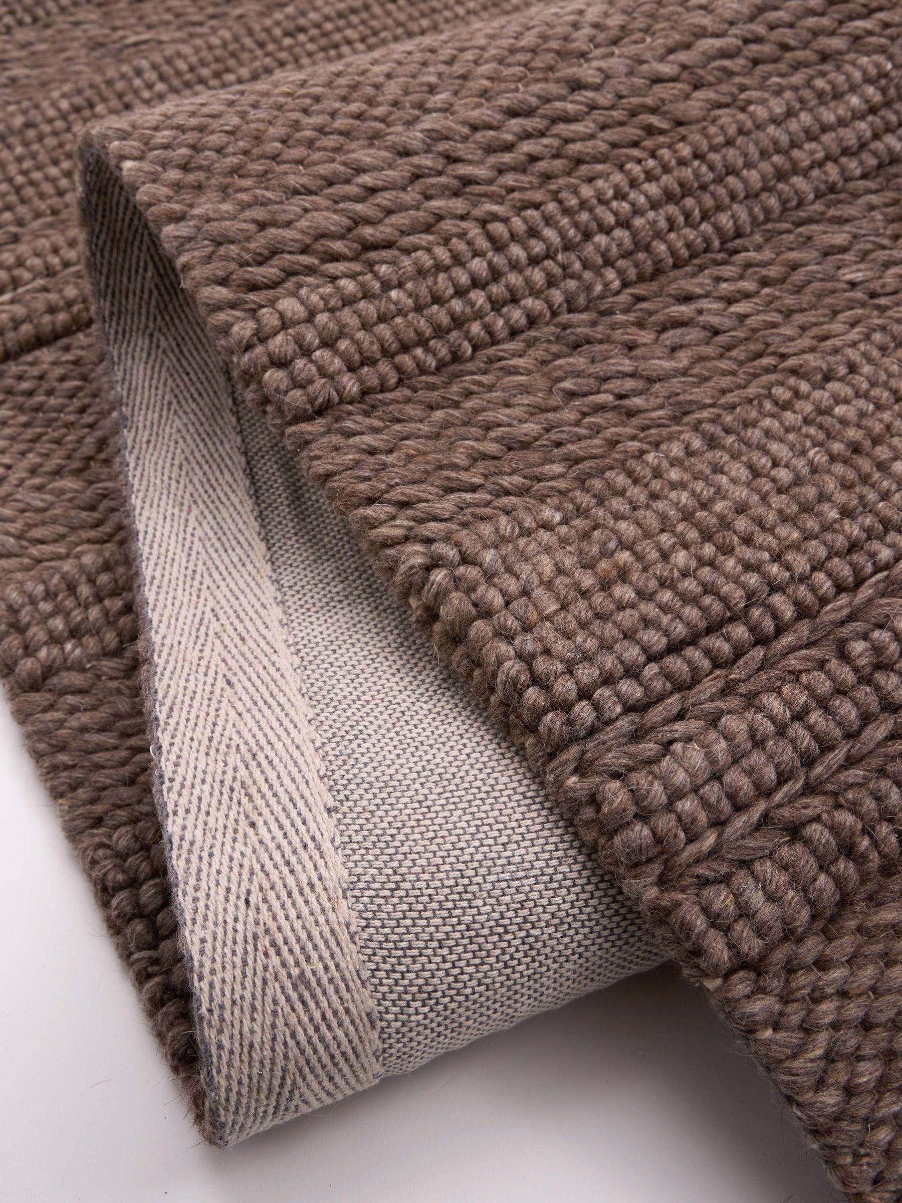 Origin Rugs brown chunky knit rug, hand-woven wool blend (British brand)