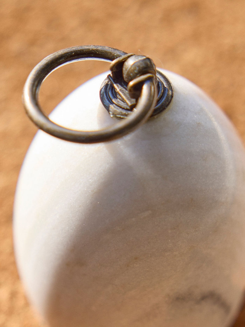 Dibor white marble doorstop with metallic ring, imported from the UK