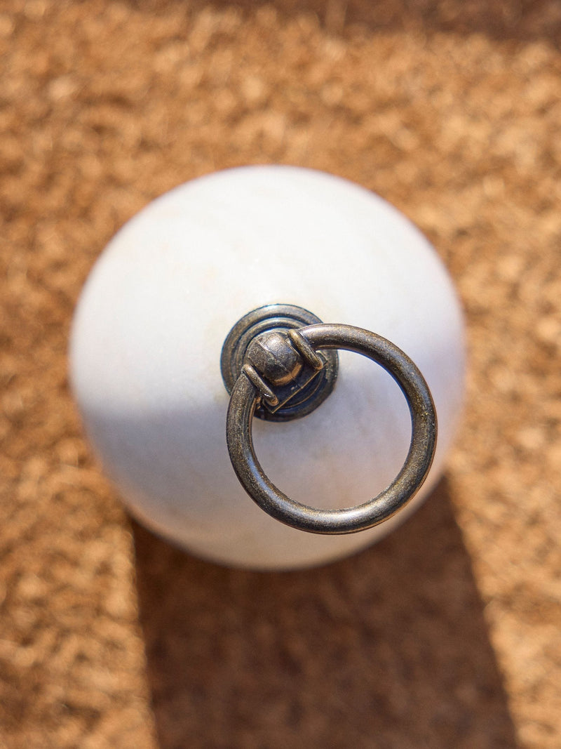 Dibor white marble doorstop with metallic ring, imported from the UK