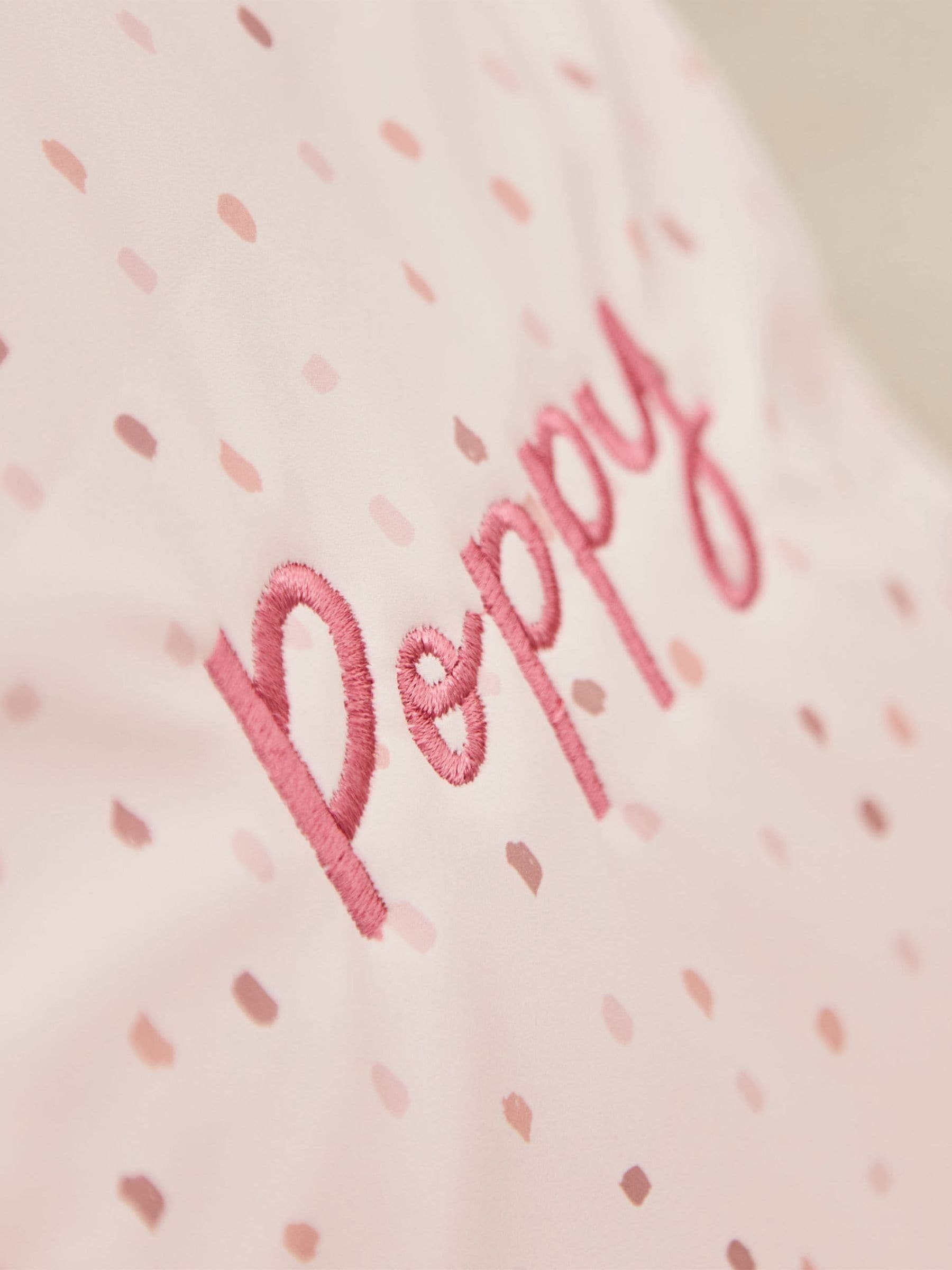 Pink polka dot tiny personalised backpack (British brand)
