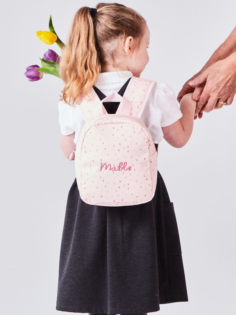 Pink polka dot tiny personalised backpack (British brand)