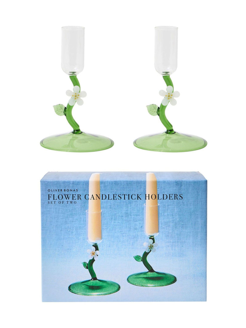 Oliver Bonas green glass candlestick holders with flower motifs, imported from the UK