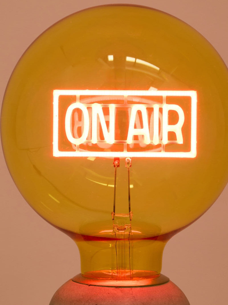 Oliver Bonas yellow On Air glass light bulb (British brand)