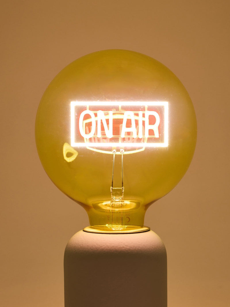 Oliver Bonas yellow On Air glass light bulb (British brand)