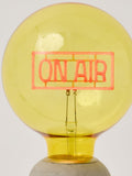 Oliver Bonas yellow On Air glass light bulb (British brand)