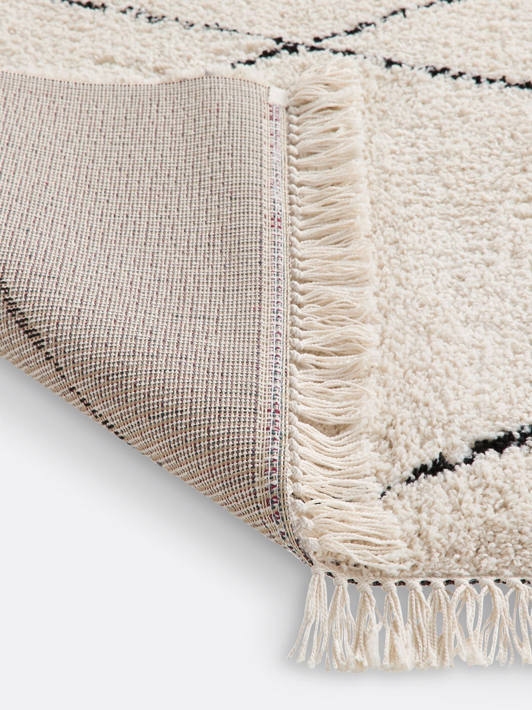 La Redoute Intérieurs Fatouh fringed Berber style rug in ecru, imported from the UK