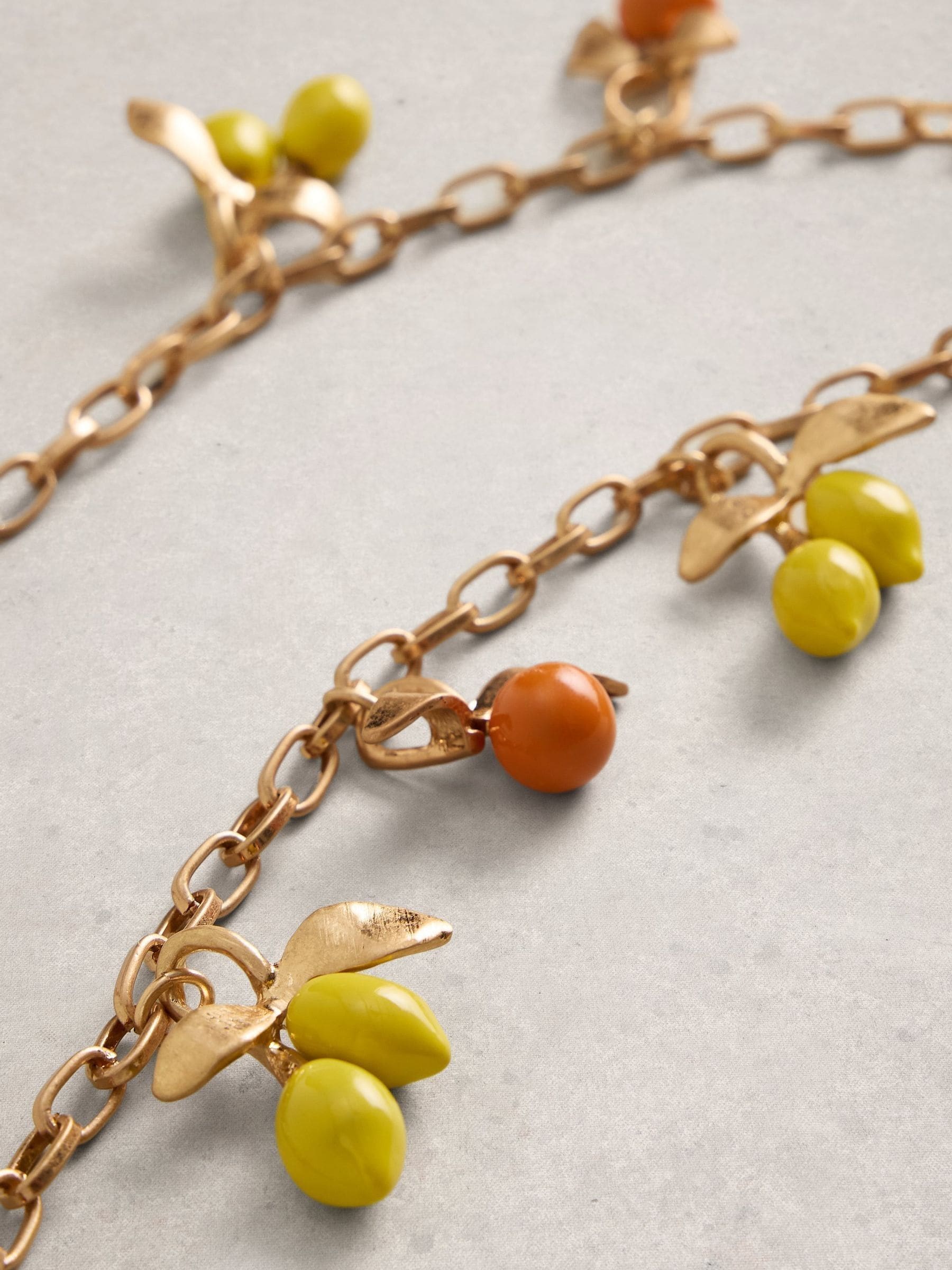 White Stuff yellow citrus charm necklace, UK version