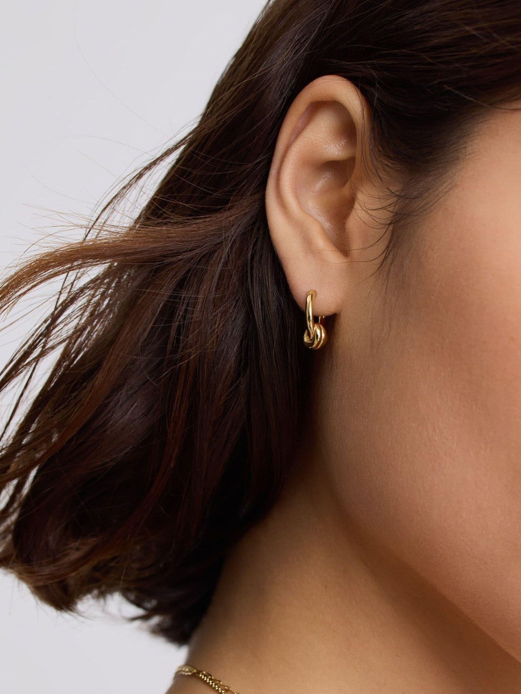 D.LOUISE gold tone waterproof knot twist mini hoops (British brand)