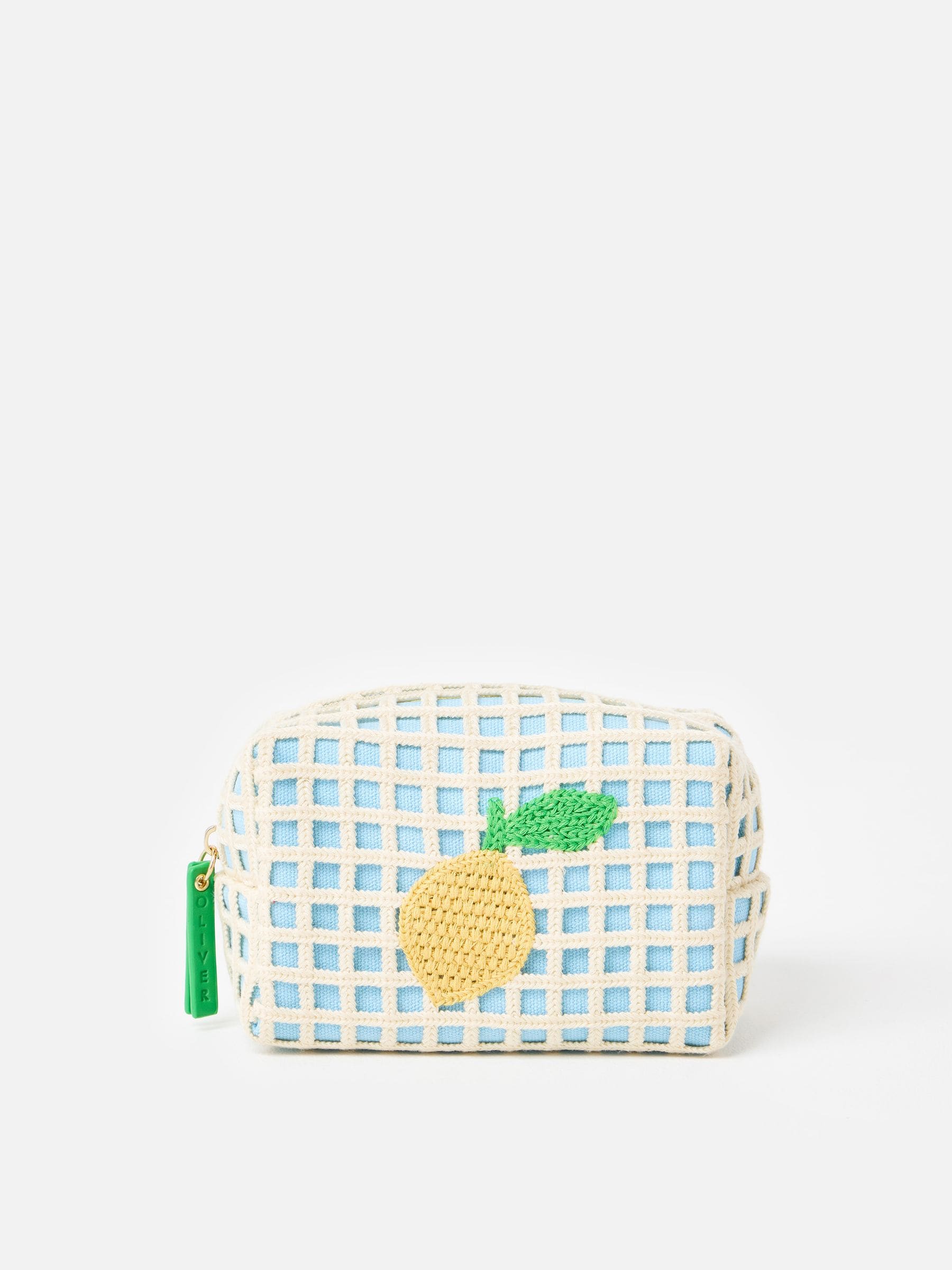 Oliver Bonas blue crochet makeup bag with lemon motif (British brand)