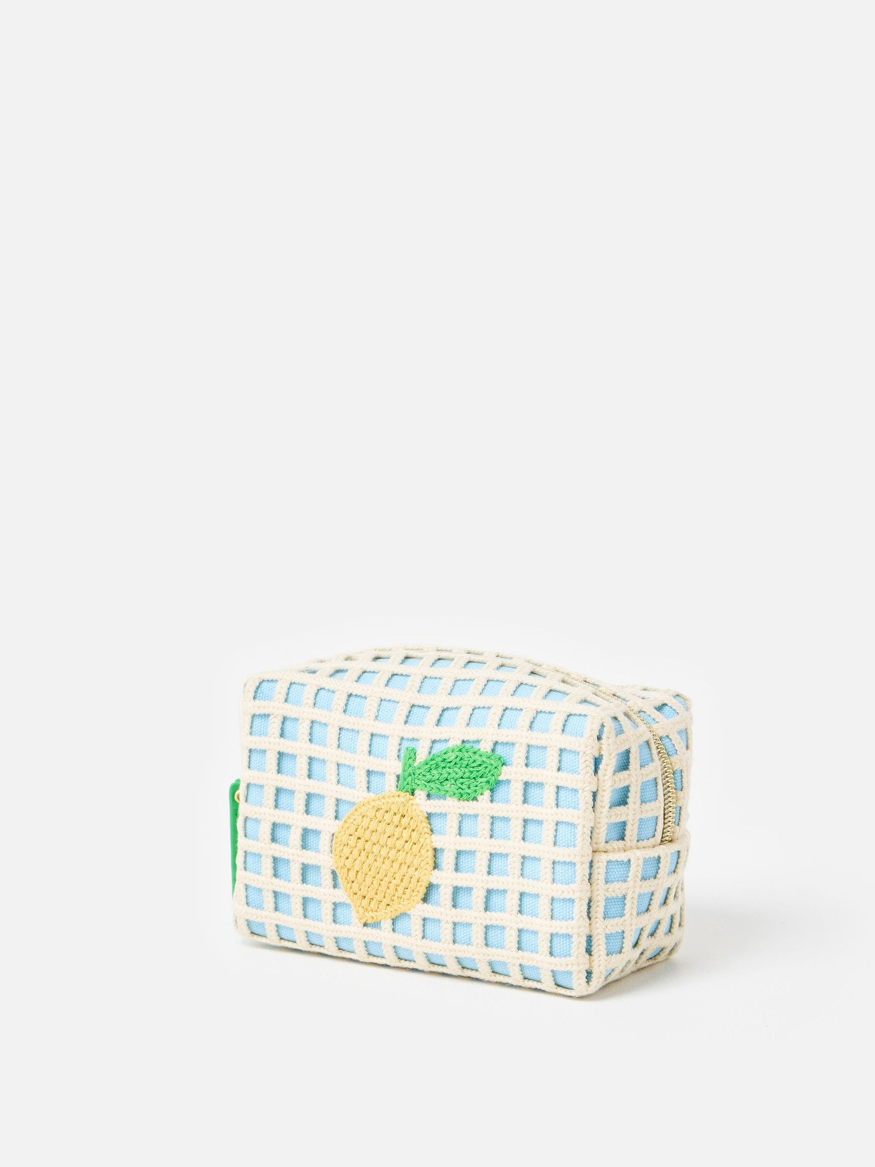 Oliver Bonas blue crochet makeup bag with lemon motif (British brand)