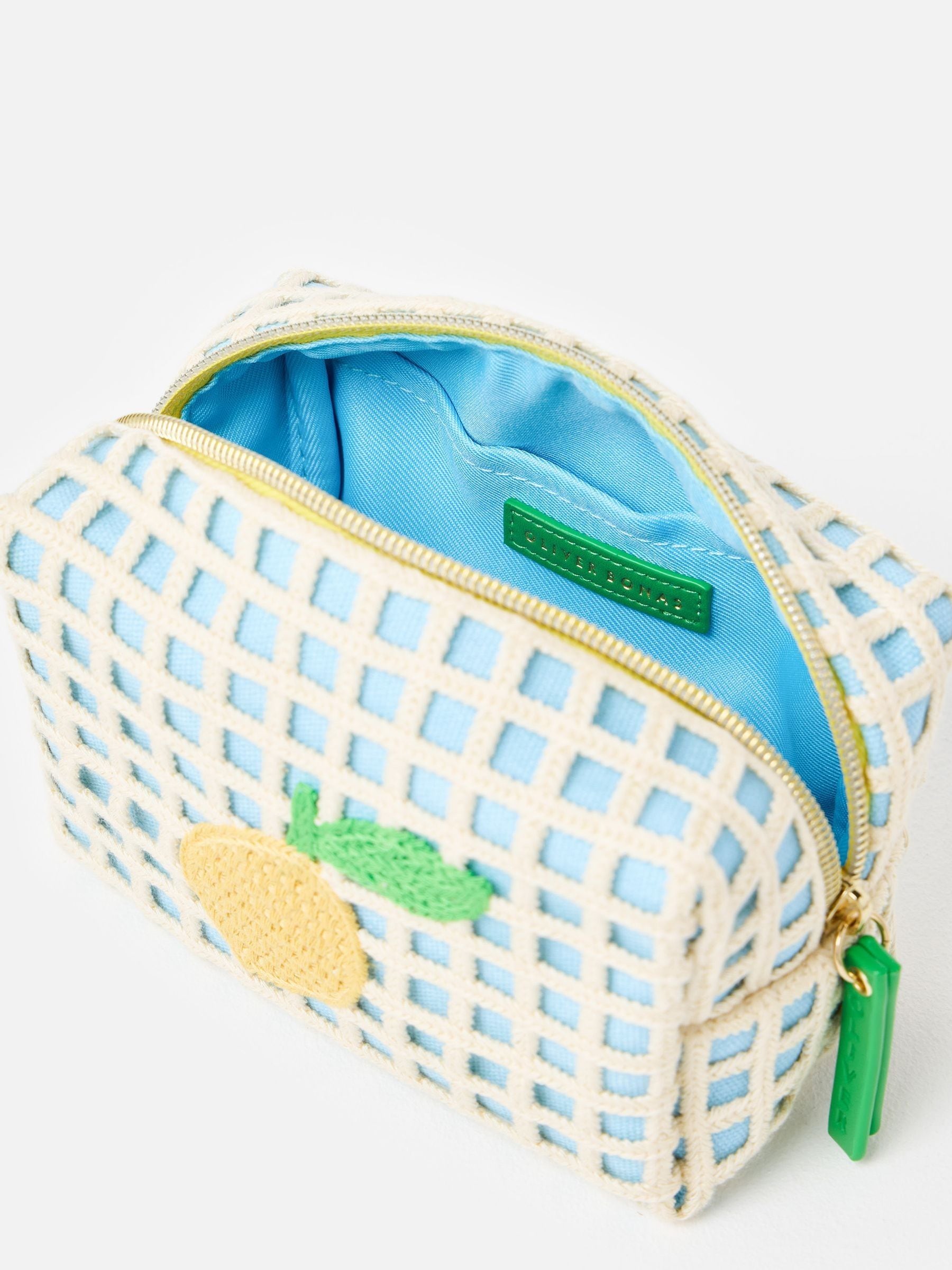 Oliver Bonas blue crochet makeup bag with lemon motif (British brand)