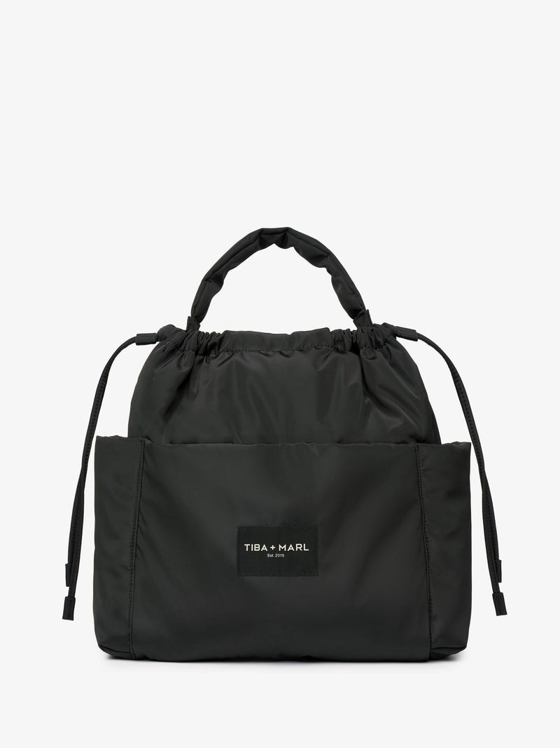 Tiba + Marl Black Luna drawstring changing tote - British product