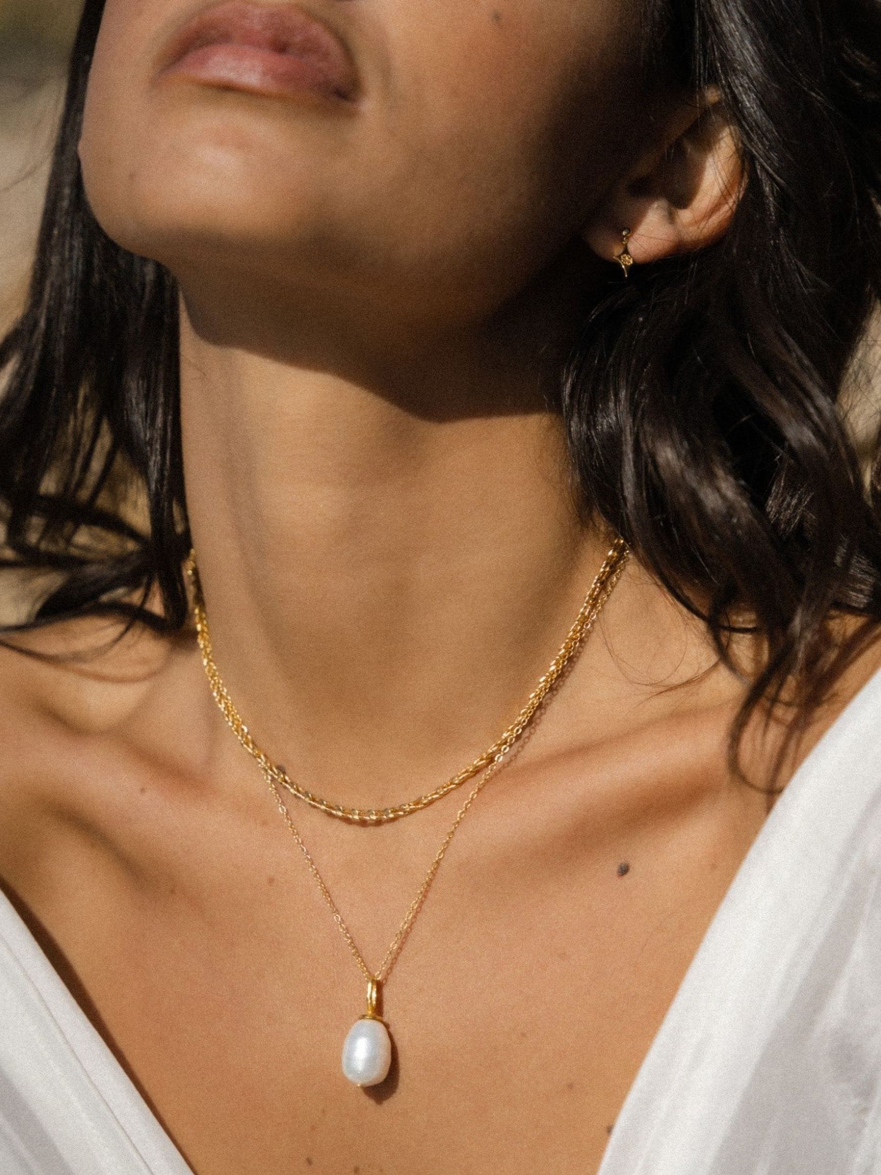 Ottoman Hands Thea snake chain necklace gold tone t-bar (British brand)