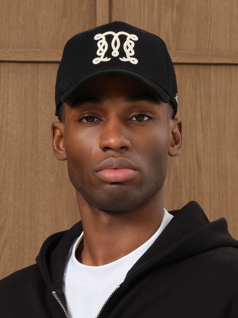 MAUVAIS Black Monogram Trucker Cap in cotton twill (British brand)