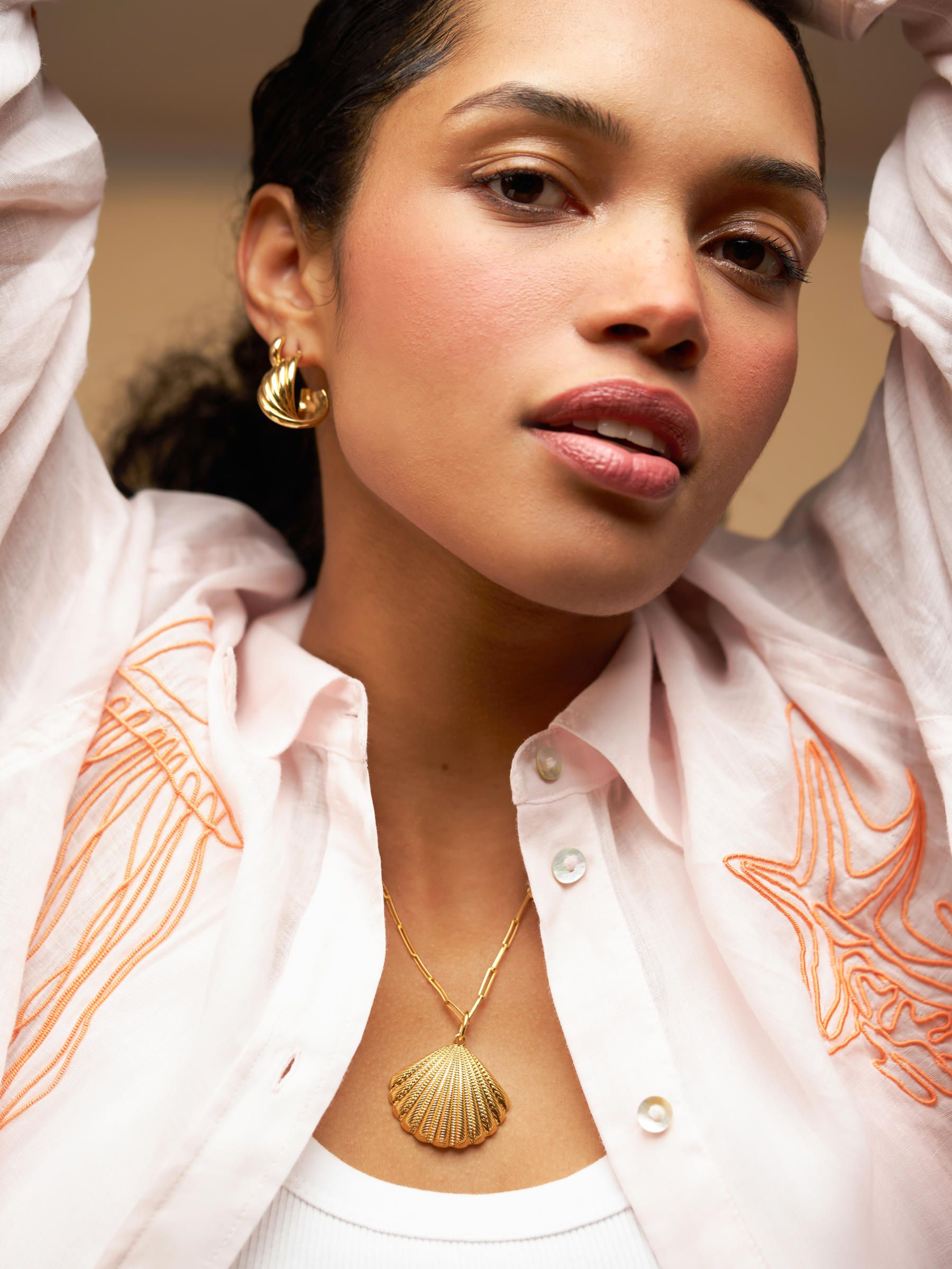 Orelia London gold tone interlocking twist hoop earrings (British brand)