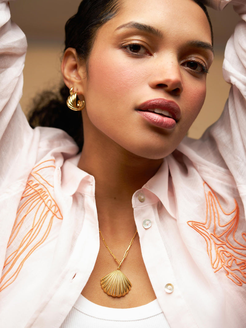 Orelia London gold tone interlocking twist hoop earrings (British brand)