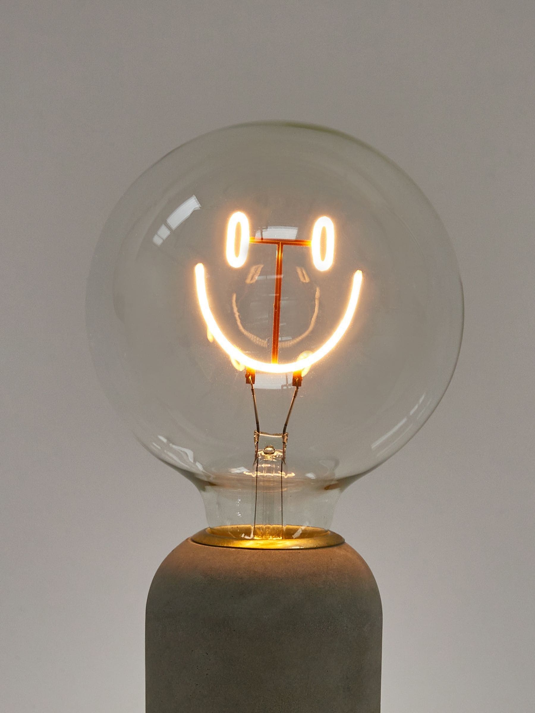 Oliver Bonas yellow happy face LED light bulb E27 (British brand)