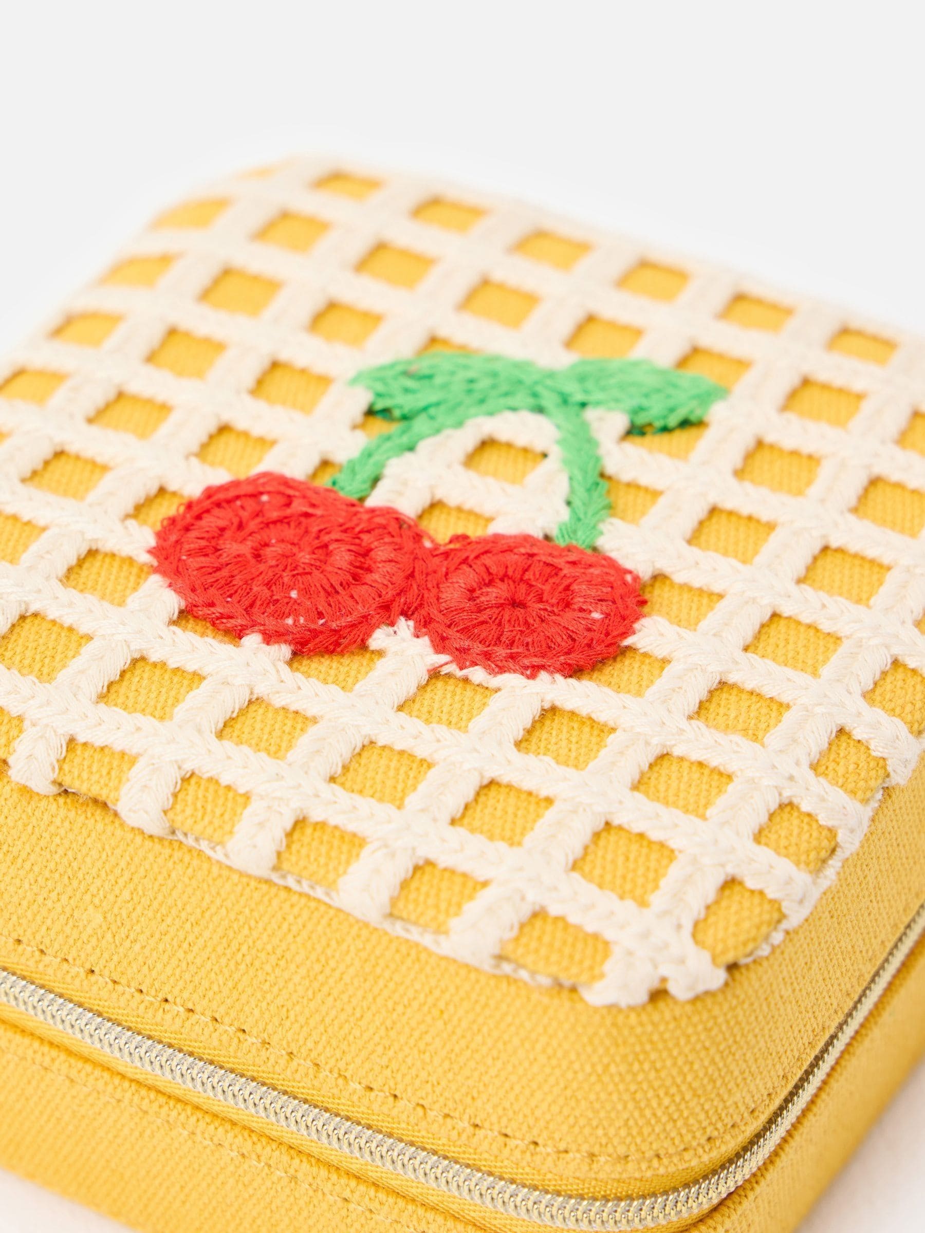 Oliver Bonas yellow crochet jewellery box with cherry motif, imported from the UK