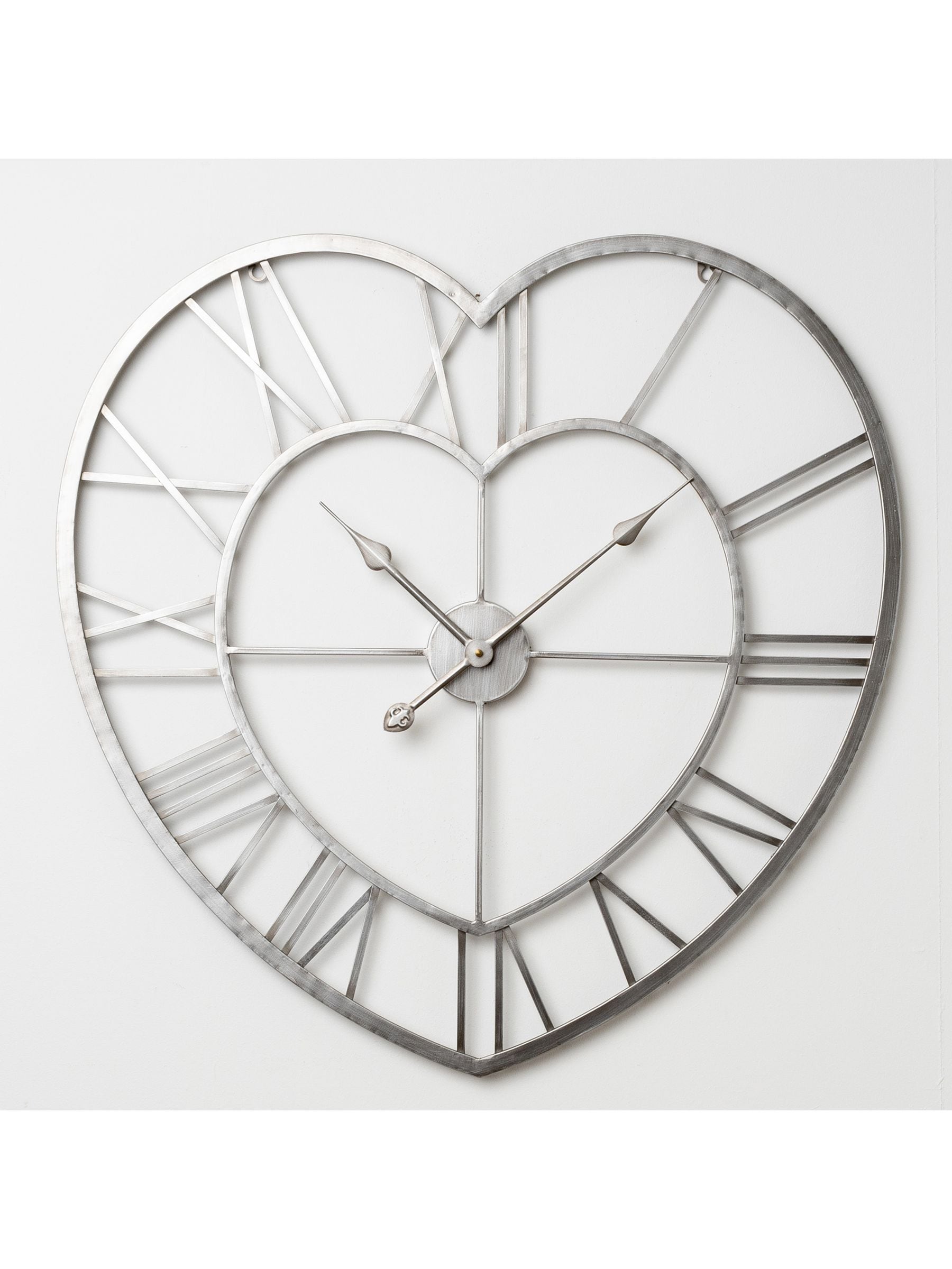 Widdop silver metal heart shaped wall clock, imported from the UK