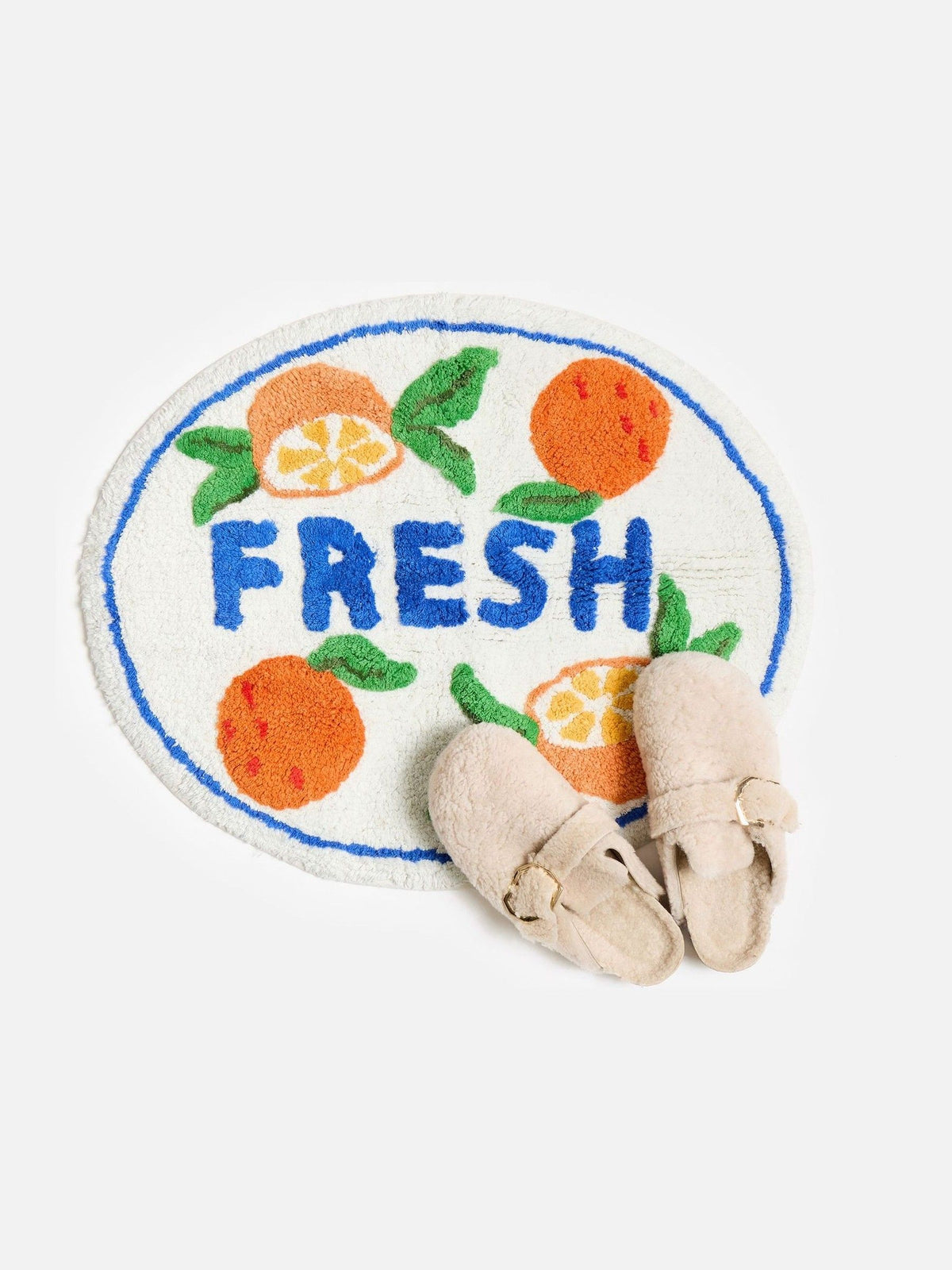 Oliver Bonas orange fresh round tufted bath mat, imported from the UK