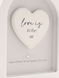 Widdop white arch plaque 18cm Love Is In The Air, imported from the UK