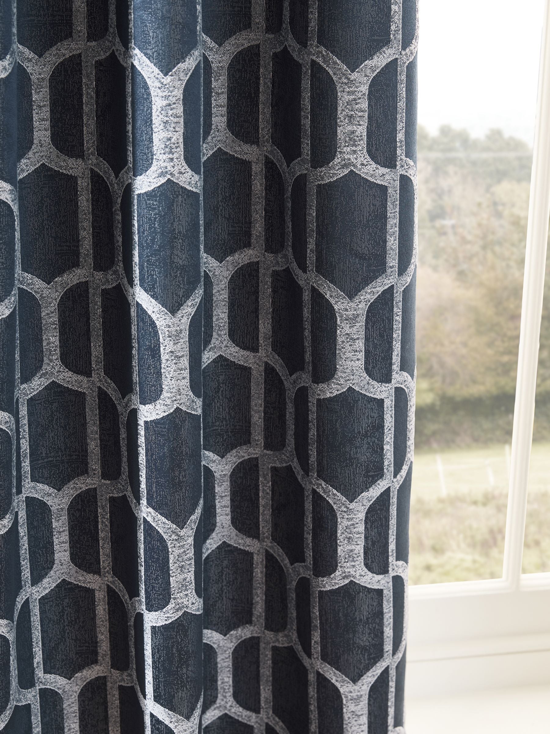 Navy blue geometric jacquard eyelet curtains (British brand)