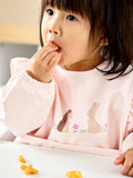 JoJo Maman Bébé pink woodland frill sleeved baby bib, imported from the UK