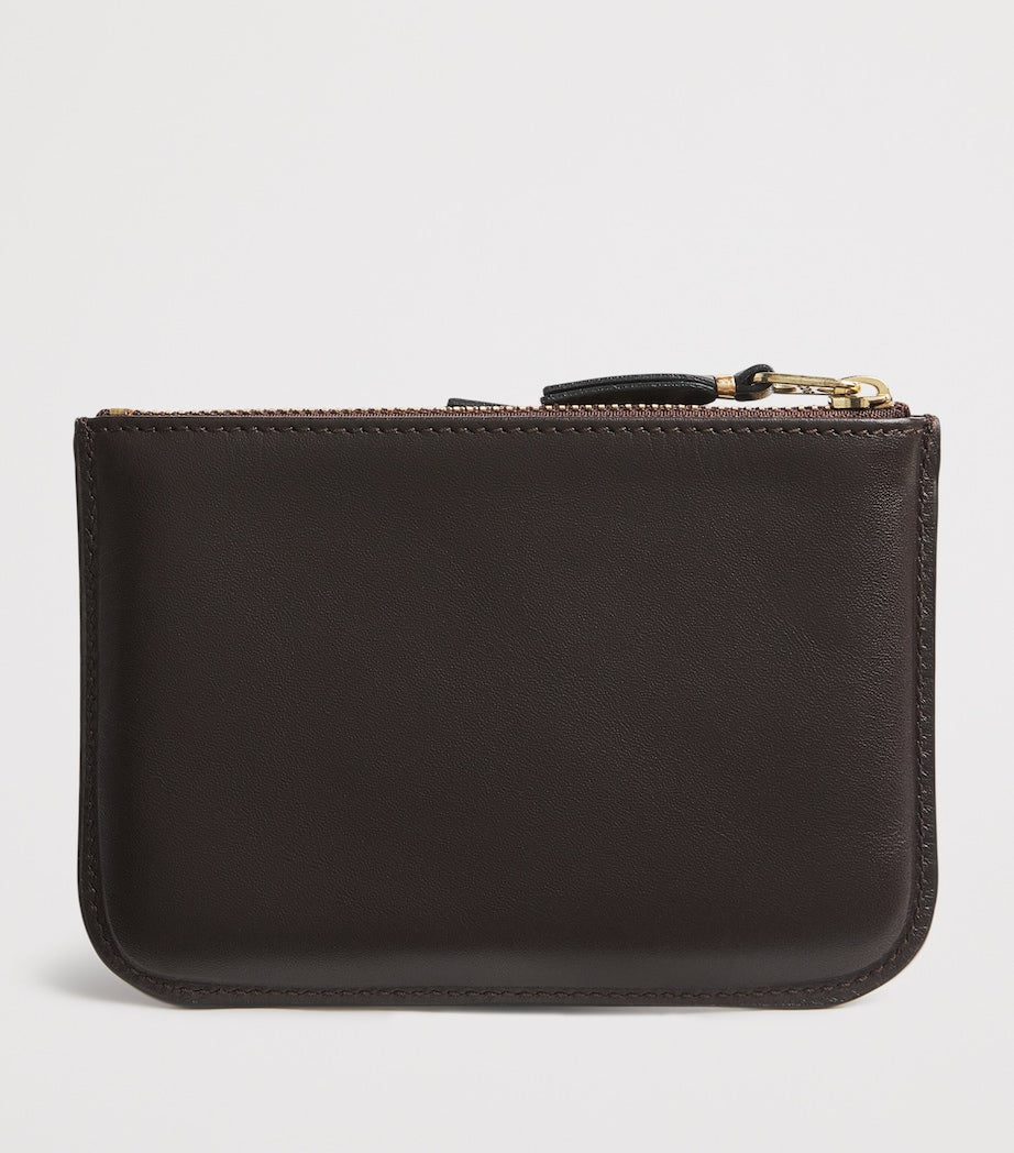 Comme des Garçons medium leather outside pocket wallet, imported from the UK