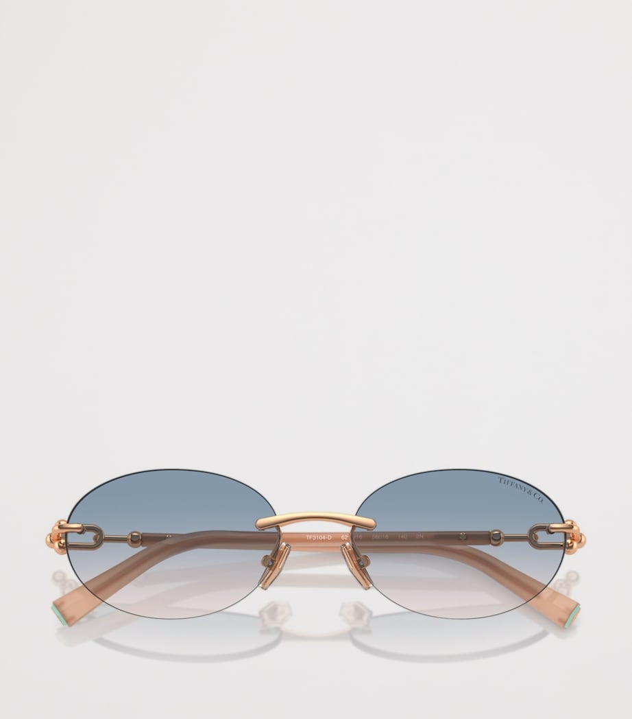 Tiffany & Co. rimless oval sunglasses with gold-tone temples, UK version