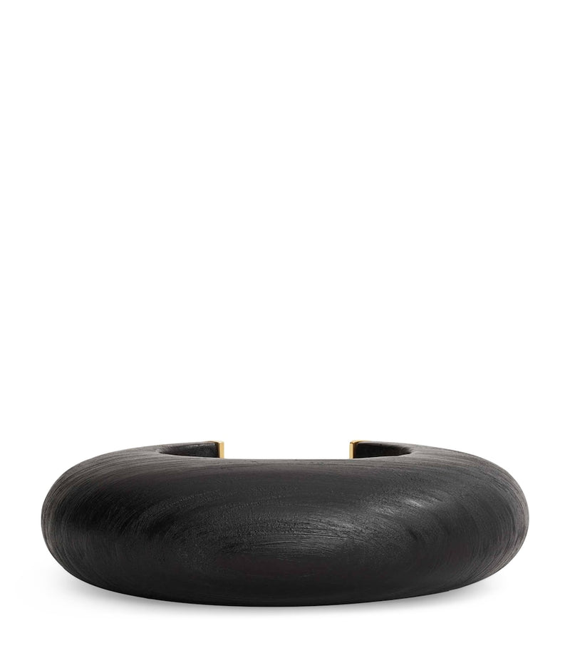 Alaïa wood and brass bumper cuff, imported from the UK