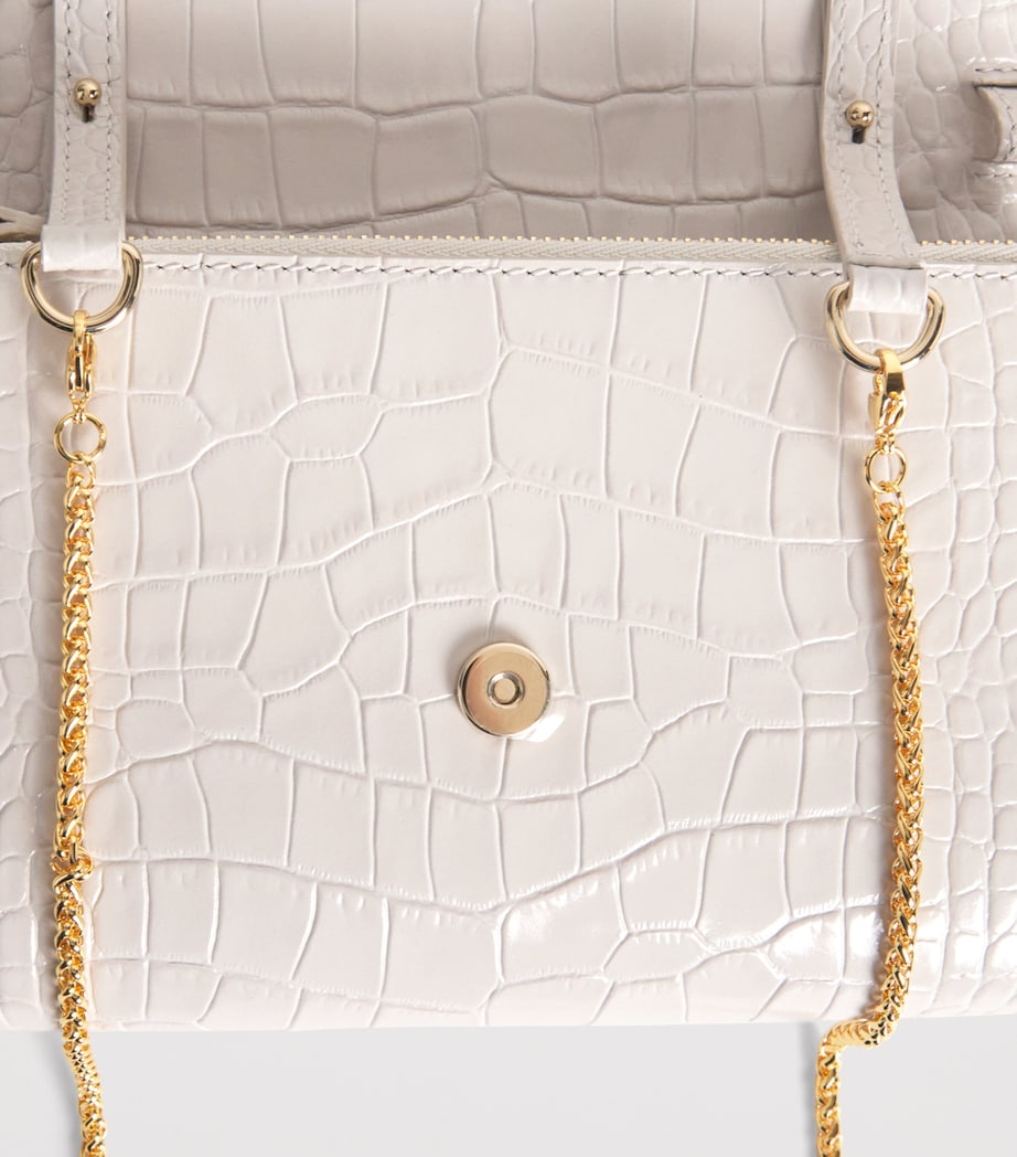 Jeffrey Levinson leather croc-embossed clutch bag, UK version