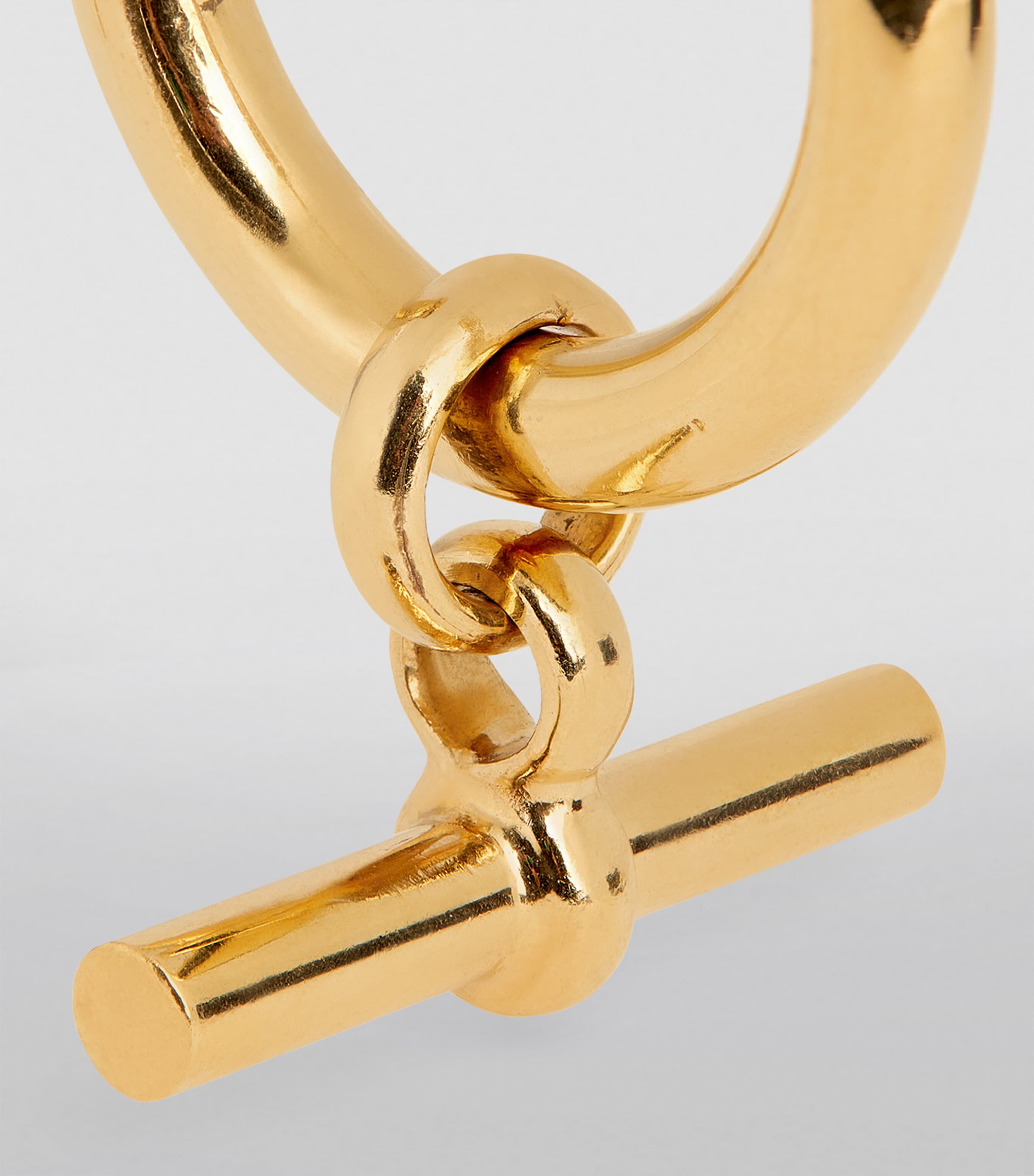 Tilly Sveaas large gold-plated T-bar hoop earrings, UK version