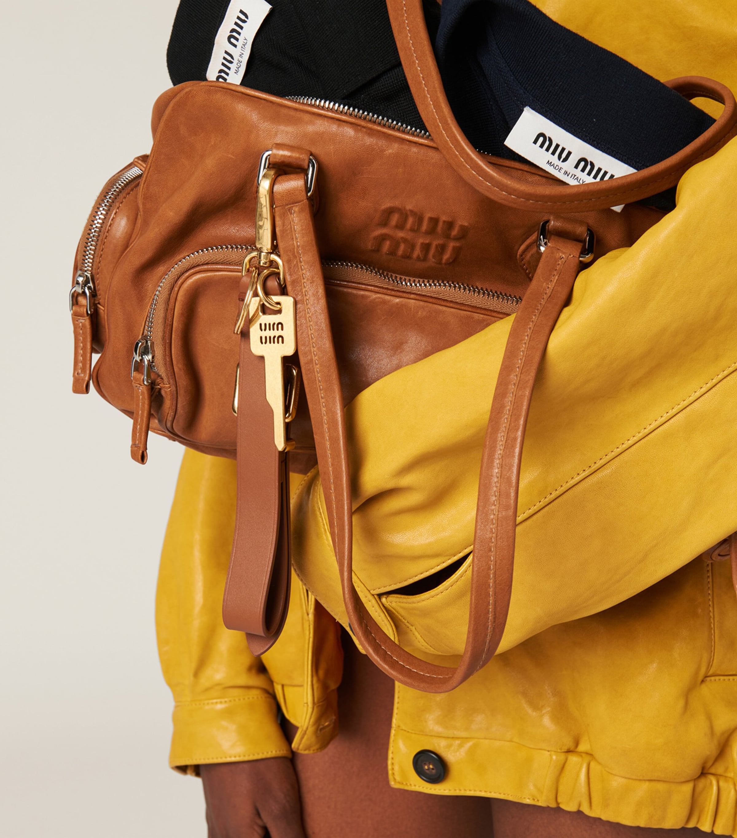 Miu Miu nappa leather top-handle bag with pockets (British brand)