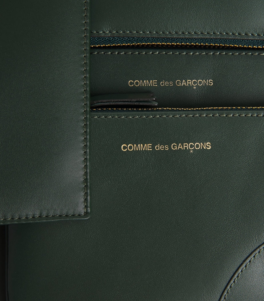 Comme des Garçons small leather pouch from Wallet line, UK version