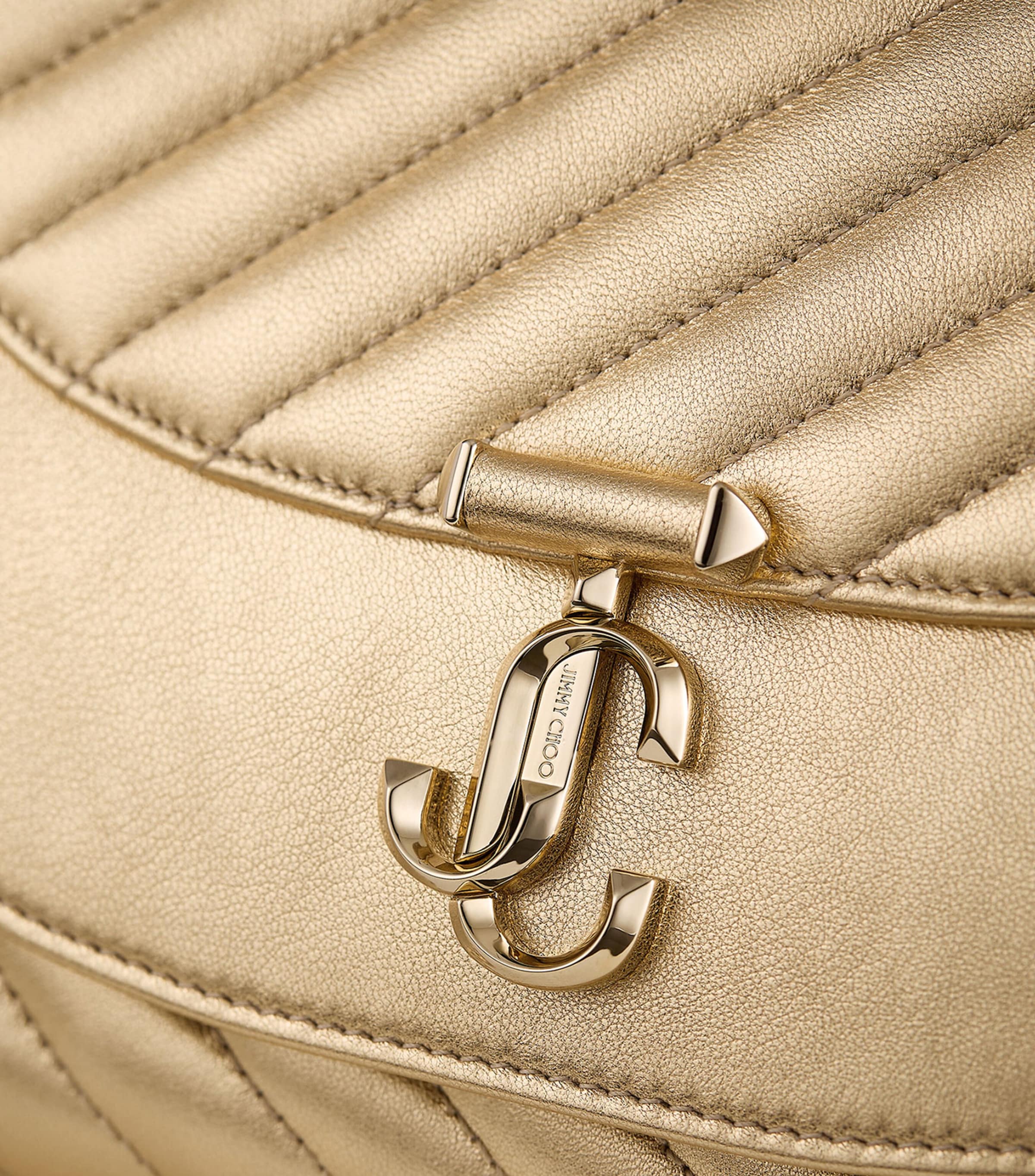 Jimmy Choo Curve clutch bag in metallic leather, imported from the UK