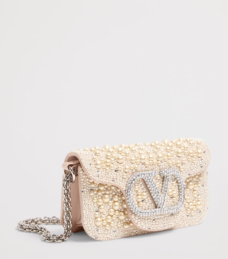 Valentino Garavani small embellished Locò shoulder bag, imported from the UK